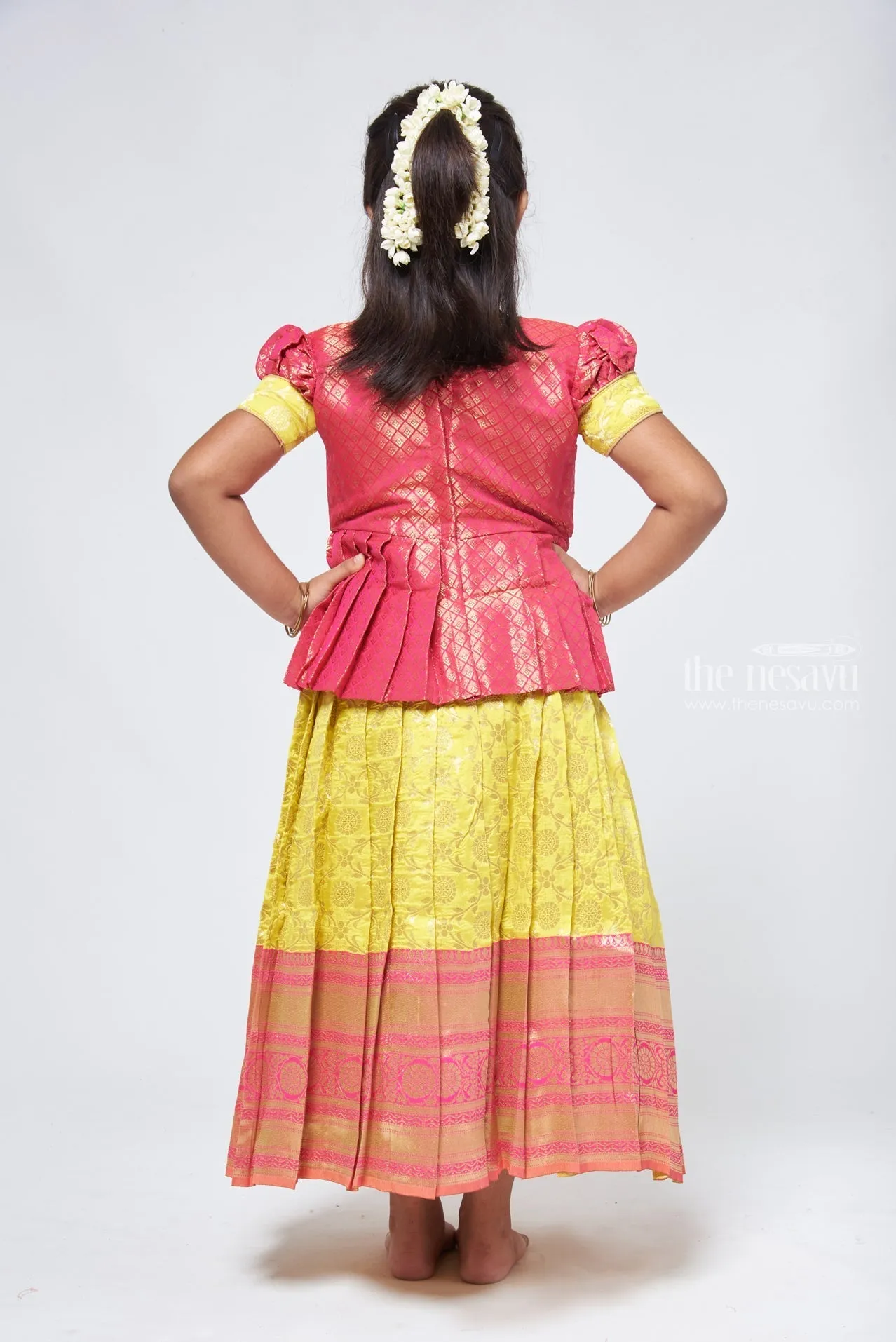 Dazzling Brocade Pink Peplum Top with Banarasi Yellow Pattu Langa: Classic Silk Beauty